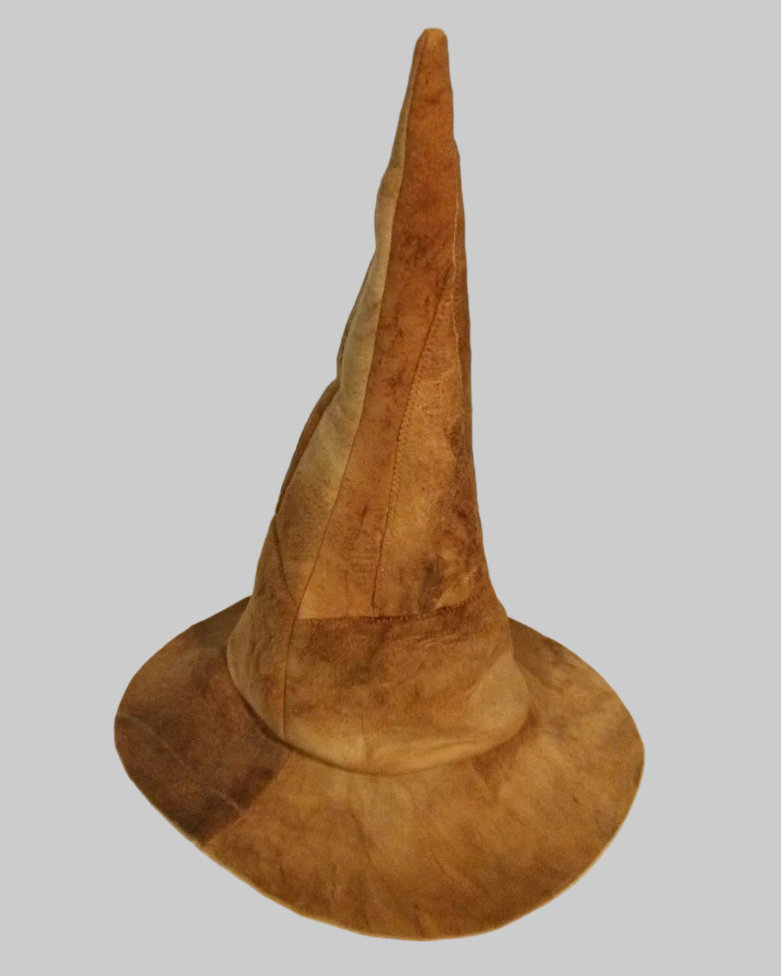 Brown amadou wizard hat on white background